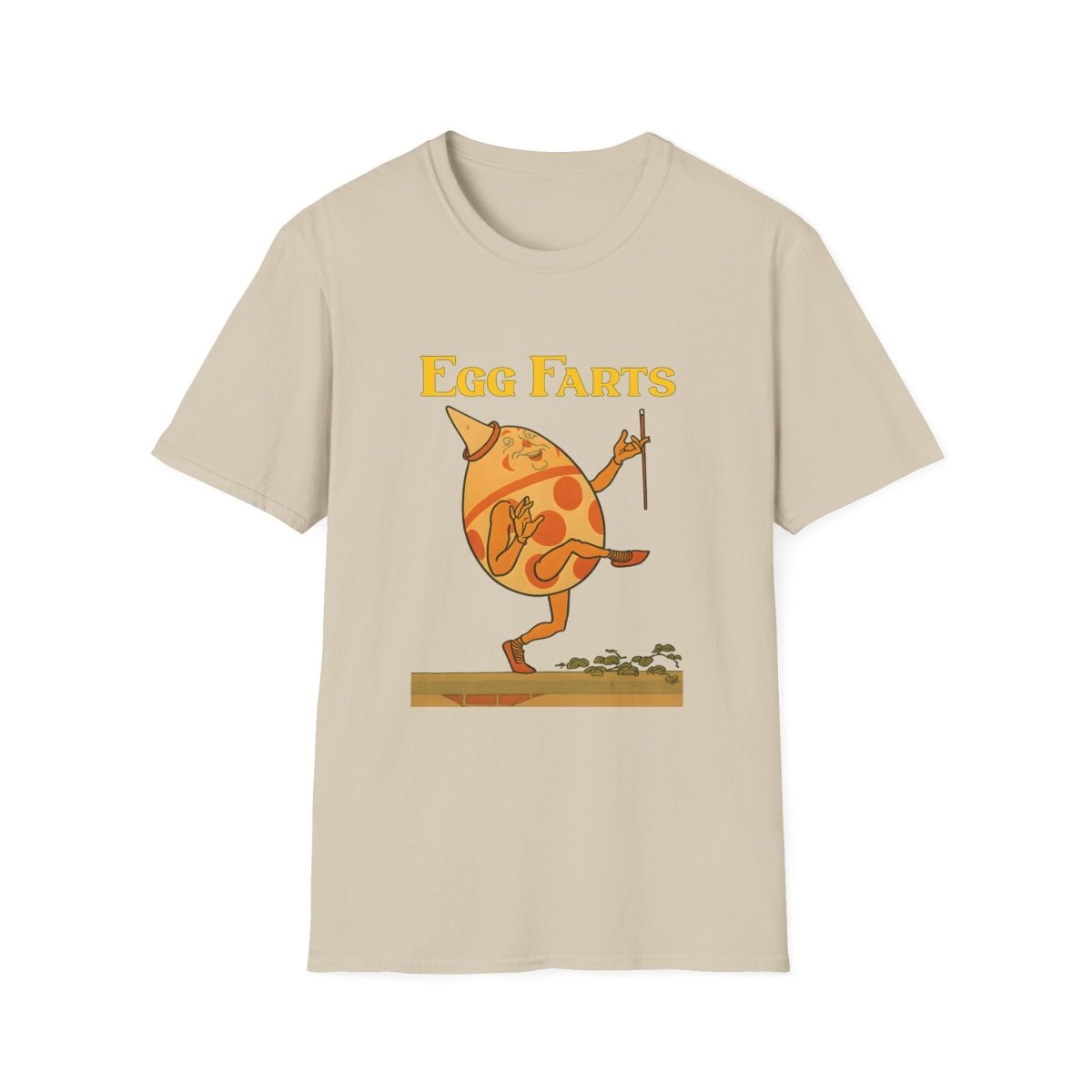 Beiges T-Shirt mit anthropomorphem Ei im Retro Kinderbuch-Satire-Stil, das auf einer Plattform tanzt und jongliert, von True Insights.